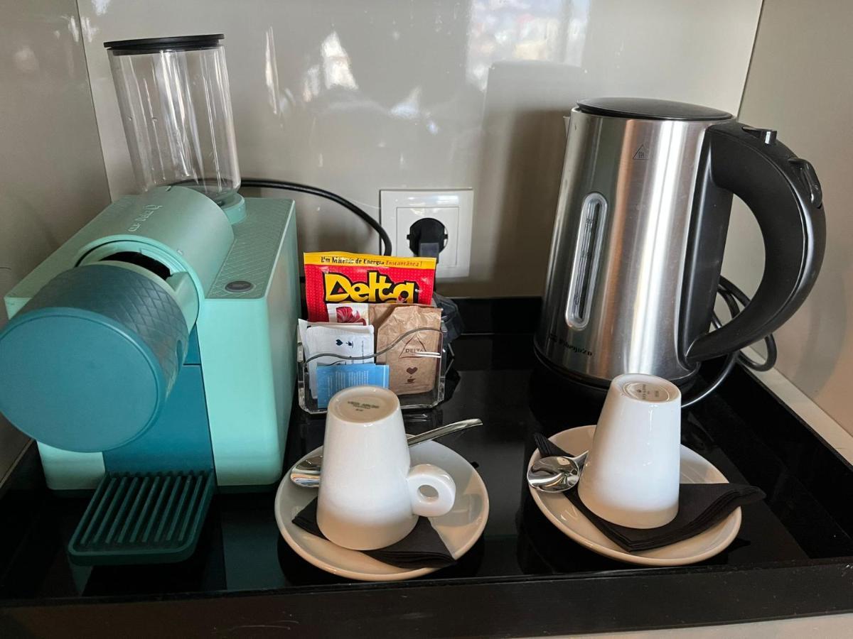 Melia Braga Hotel & Spa Eksteriør bilde A Nespresso coffee machine in a hotel room